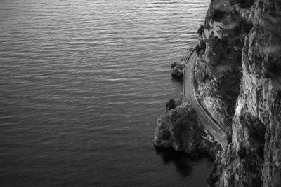 High angle view of rocks at sea shore