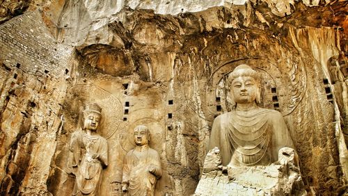 Low angle view of buddha statue at temple