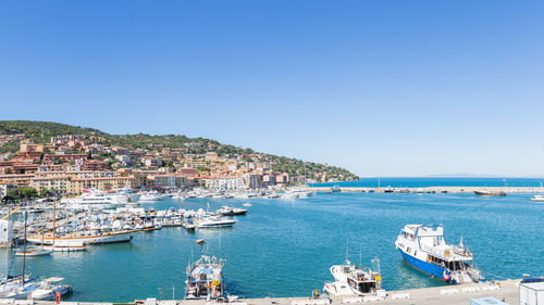 Scenic view of sea against clear blue sky