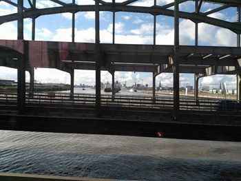 Railroad station platform seen through window