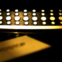 Close-up of illuminated lights at night