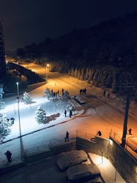 High angle view of people in winter at night