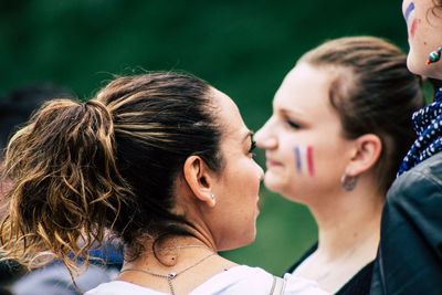 Portrait of friends against blurred background