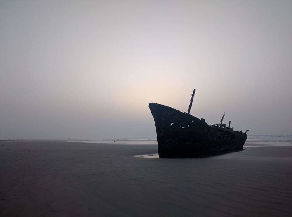 nautical vessel, sea, water, ship, transportation, nature, mode of transportation, no people, sky, shipwreck, sunset, tranquility, horizon over water, tranquil scene, horizon, beach, abandoned, beauty in nature, land, sinking, ruined