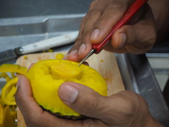 Midsection of woman holding fruits