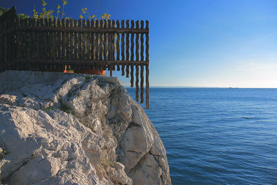 View of built structure by sea