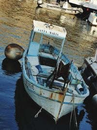 High angle view of fishing boat moored at harbor