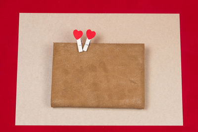 Directly above shot of heart shapes on envelope