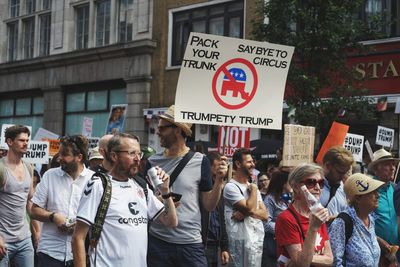 People standing on street in city