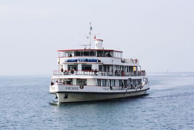 Ship sailing on sea against sky