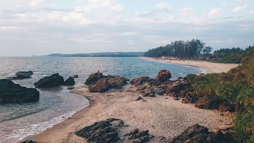 Scenic view of sea against cloudy sky