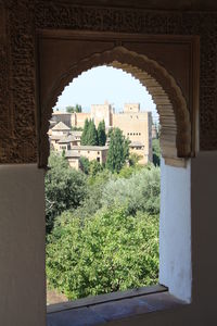 View of buildings seen through arch window