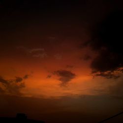 Scenic view of dramatic sky at sunset
