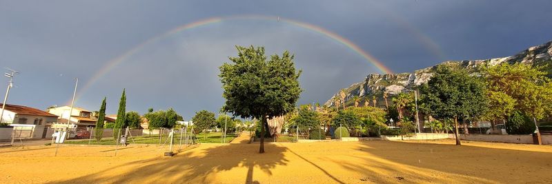 Scenic view of rainbow in town