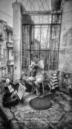 People sitting on old barn