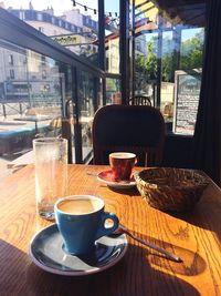 Close-up of coffee served on table at cafe