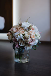 Close-up of roses in vase on table