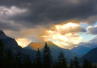 Scenic view of snowcapped mountains against sky at dusk