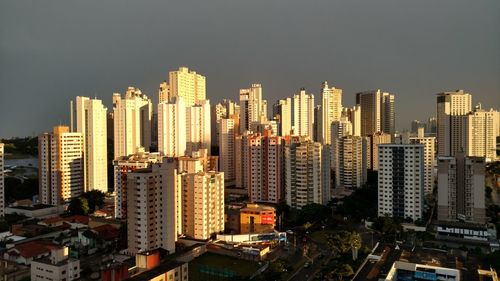 Low angle view of illuminated cityscape against sky