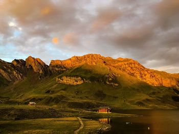 Scenic view of lake and mountains against sky