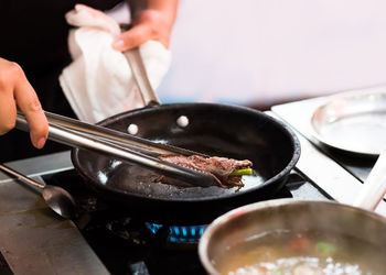 Midsection of person preparing food on table