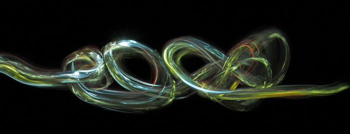 Close-up of electric lights against black background