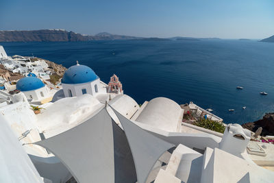 Panoramic view of sea and buildings against sky