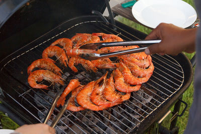 High angle view of meat on barbecue grill