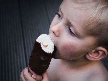 Close-up of boy eating ice cream