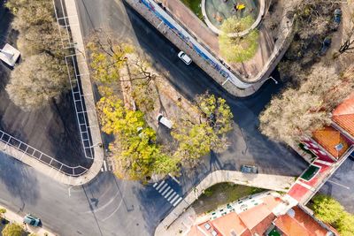 Aerial view of a campervan parked in a roundabout in lisbon, portugal.