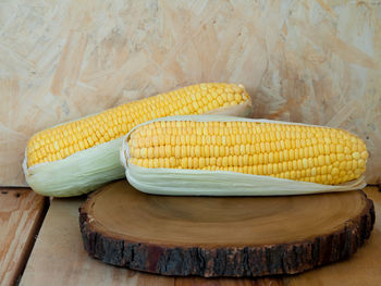 High angle view of yellow bread on cutting board