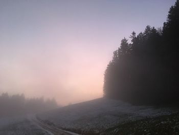 Scenic view of silhouette landscape against sky during winter