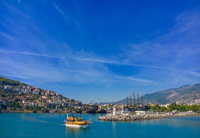 Scenic view of sea and buildings against sky