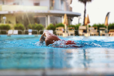 High angle view of man swimming in pool