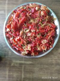 High angle view of chopped fruits in bowl on table