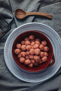 High angle view of chopped fruits in bowl on table