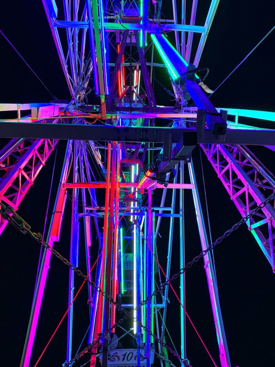 LOW ANGLE VIEW OF ILLUMINATED BRIDGE