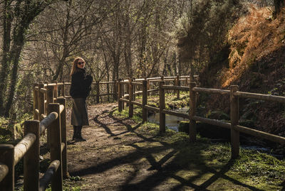 Woman next to a mountain river