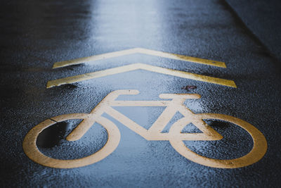 High angle view of arrow sign on road