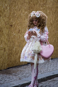 Portrait of girl with pink umbrella