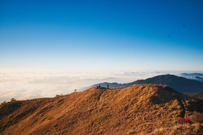 Scenic view of mountain against blue sky