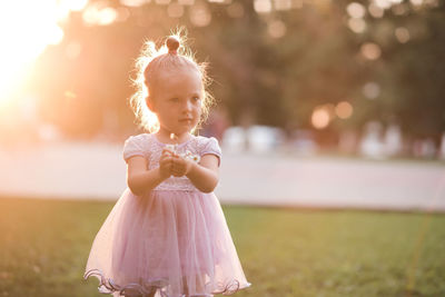 Cute girl standing at park