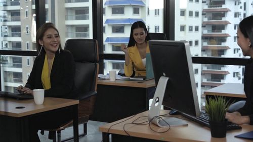 Woman working on table in office