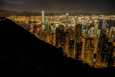 High angle view of illuminated buildings in city at night