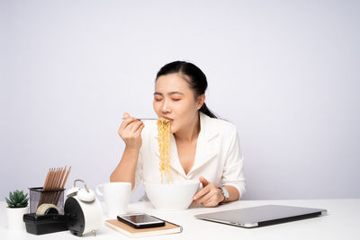 Young woman using laptop on table