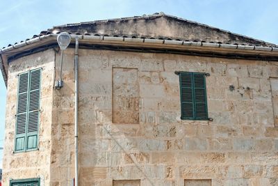 Low angle view of old building against sky