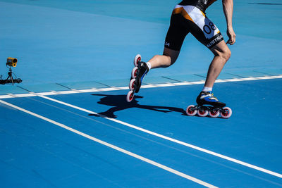 Low section of man skateboarding