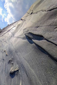 Low angle view of rock formations against sky