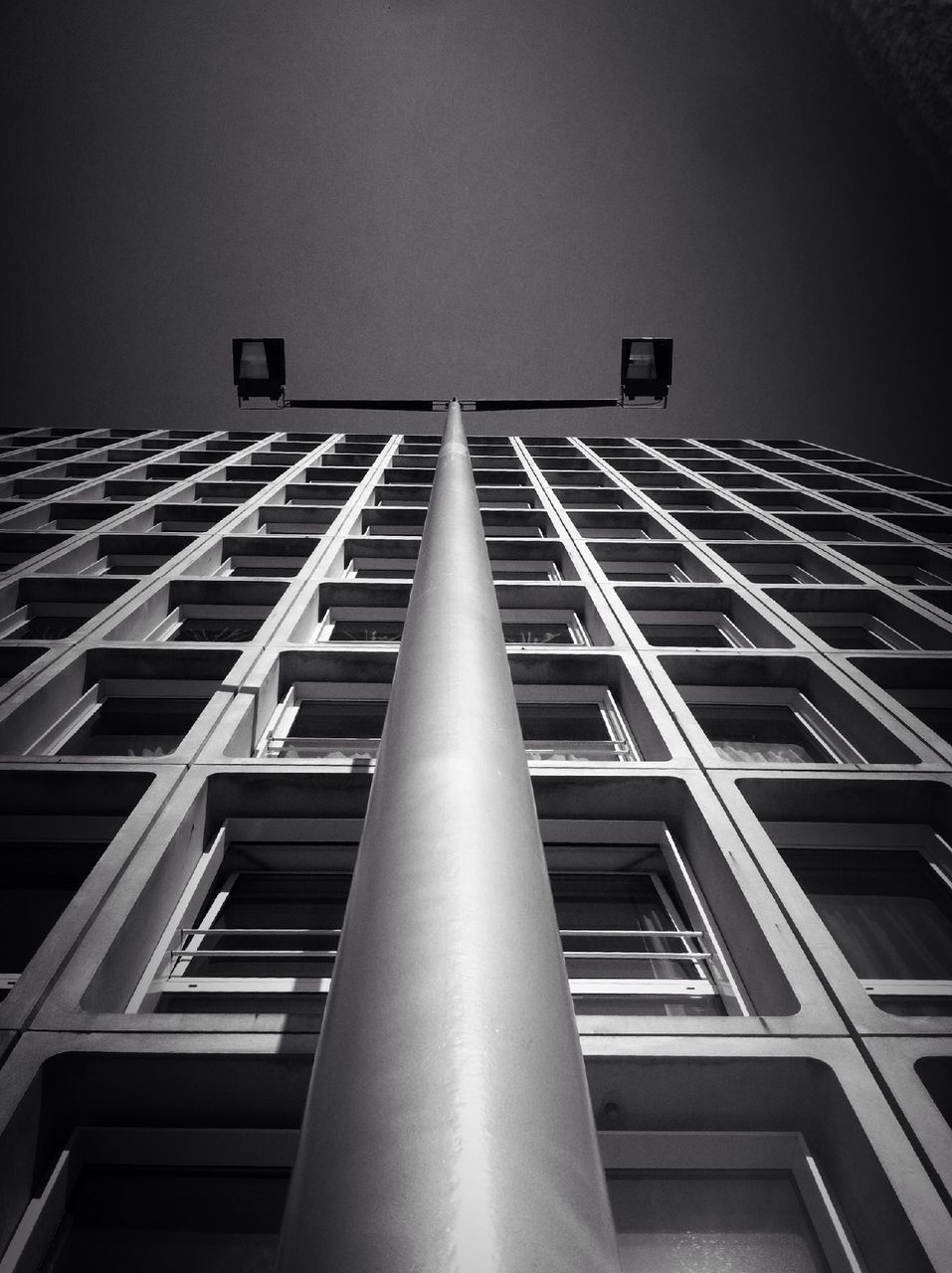 low angle view, architecture, built structure, building exterior, tall - high, building, tower, clear sky, city, sky, modern, window, office building, skyscraper, architectural feature, no people, day, tall, outdoors, directly below