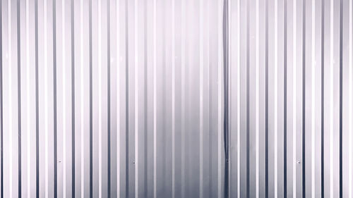 Full frame background of white corrugated metal wall